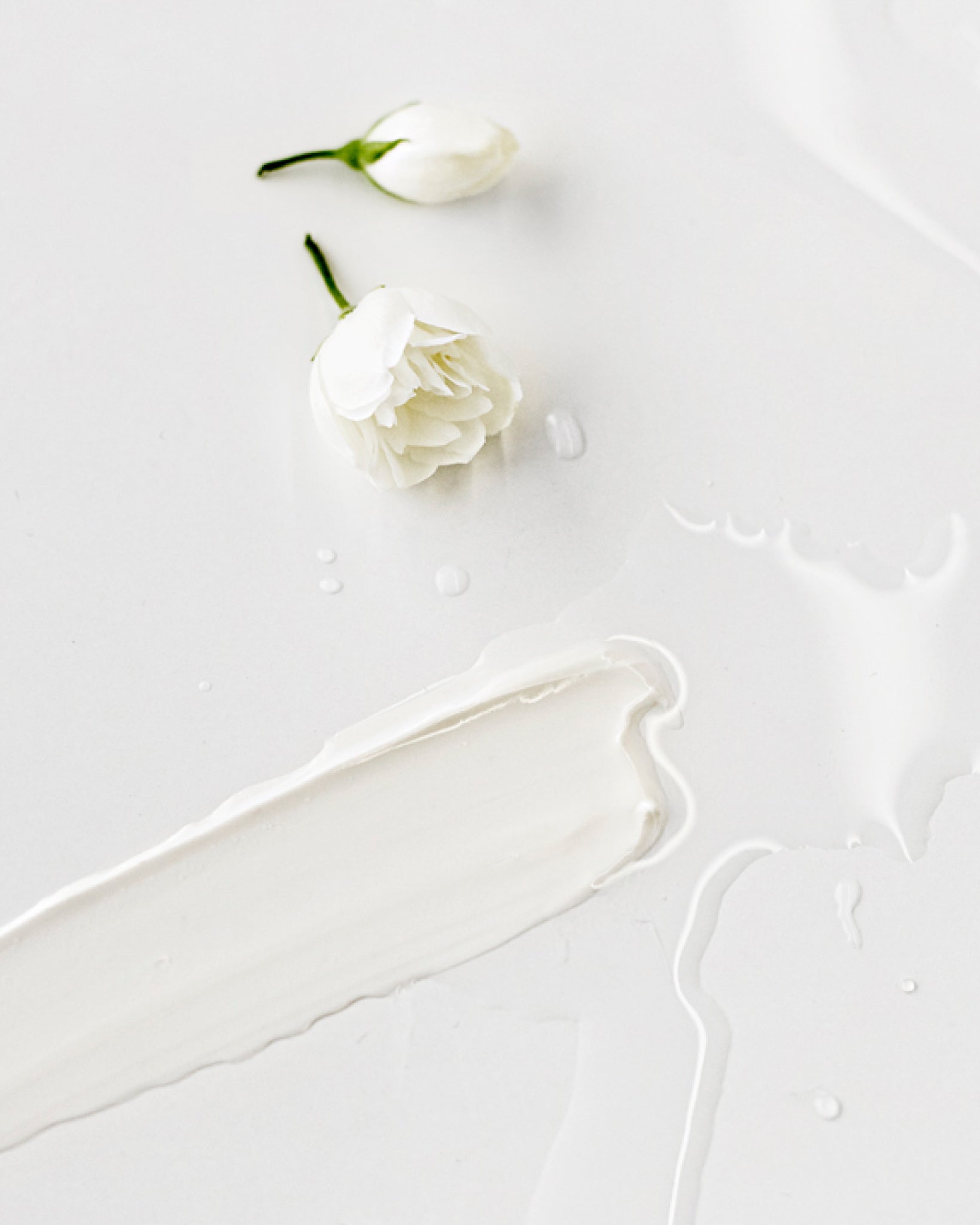 Texture close-up of MÁDARA Organic Skincare makeup cleansing milk A2002 �swatch demonstrates consistency and finish.